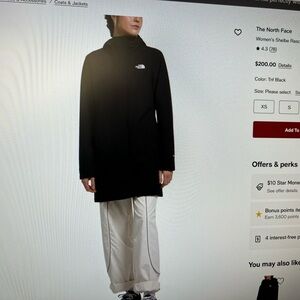 The North Face Woman’s Black wind-resistant parka, water-repellent finish